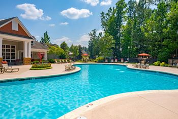 Resort-inspired saline swimming pool with lounge chairs and wifi hotspot